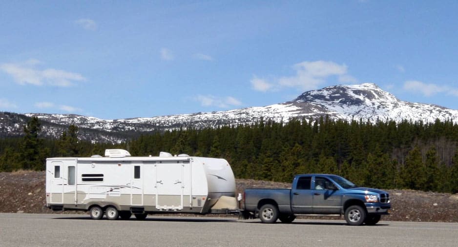Travel trailer towed by a pick up truck