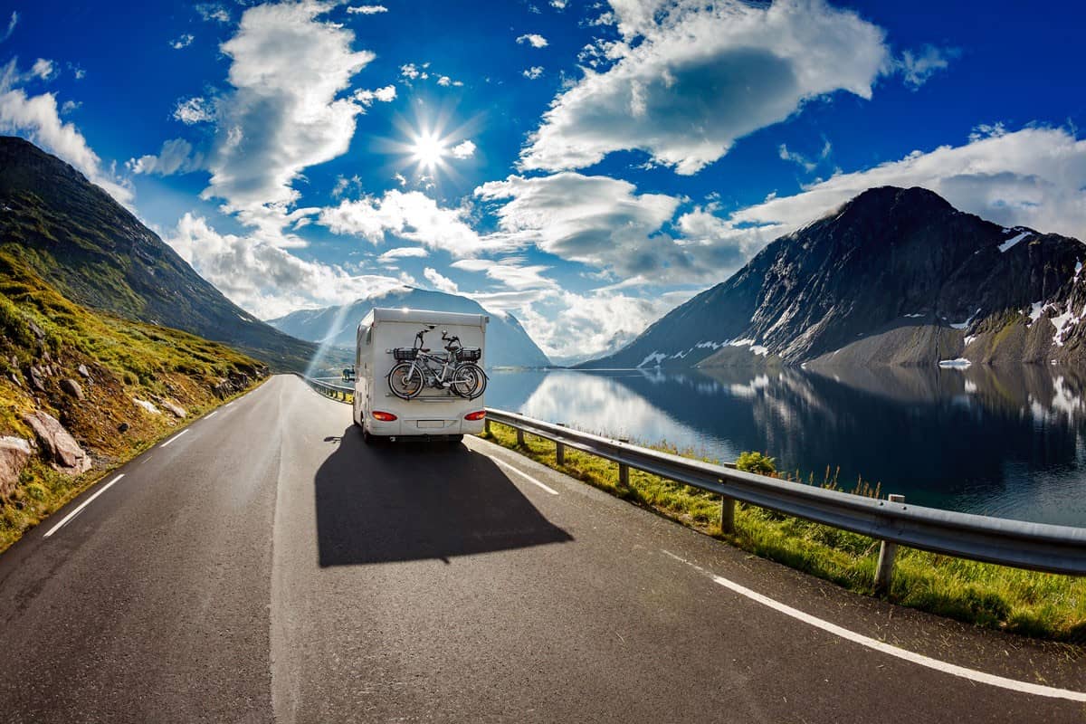 caravan car travels on highway beautiful day clear blue sky