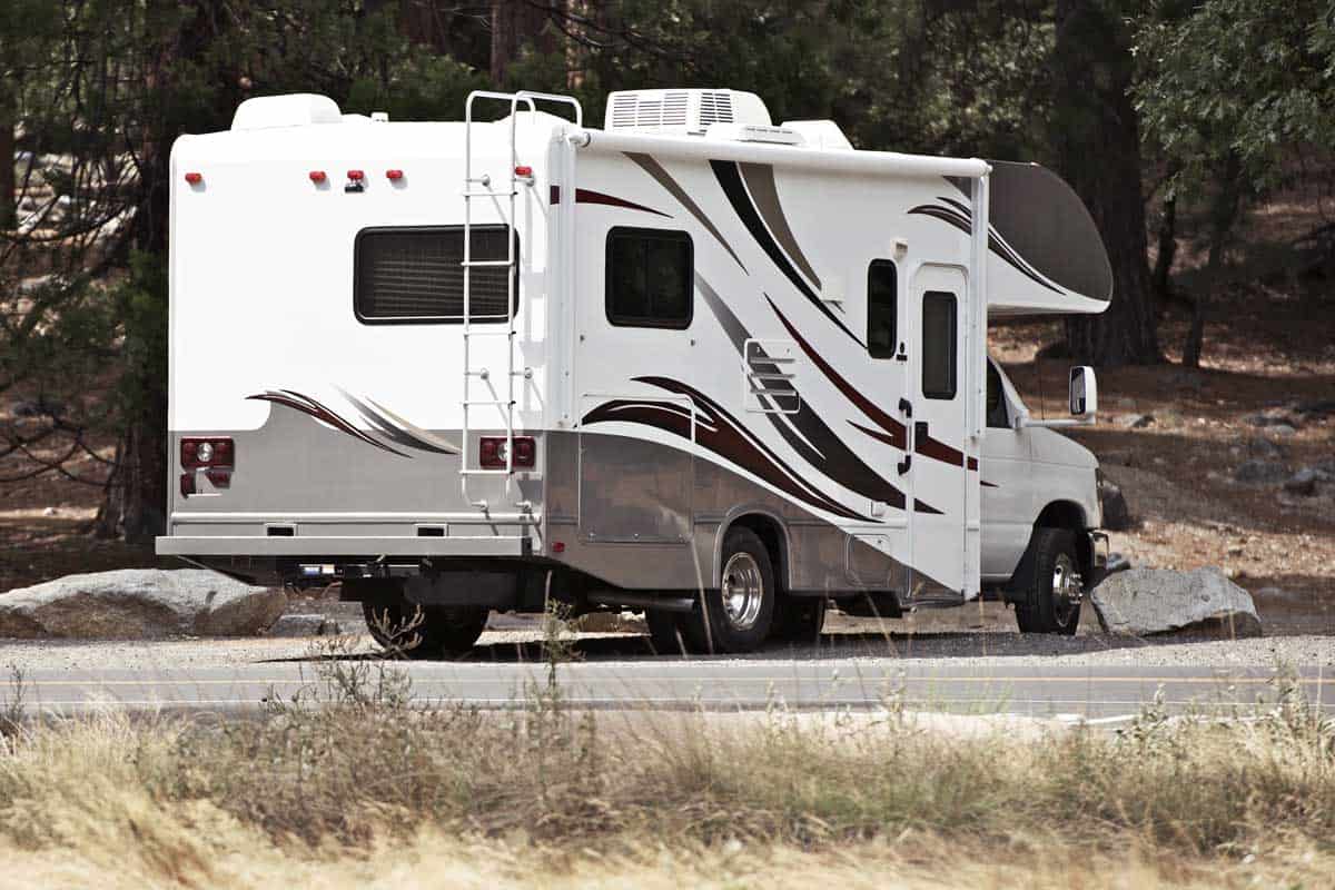 An RV parked on an RV campground, What Are the Smallest RVs with a Shower and Toilets?