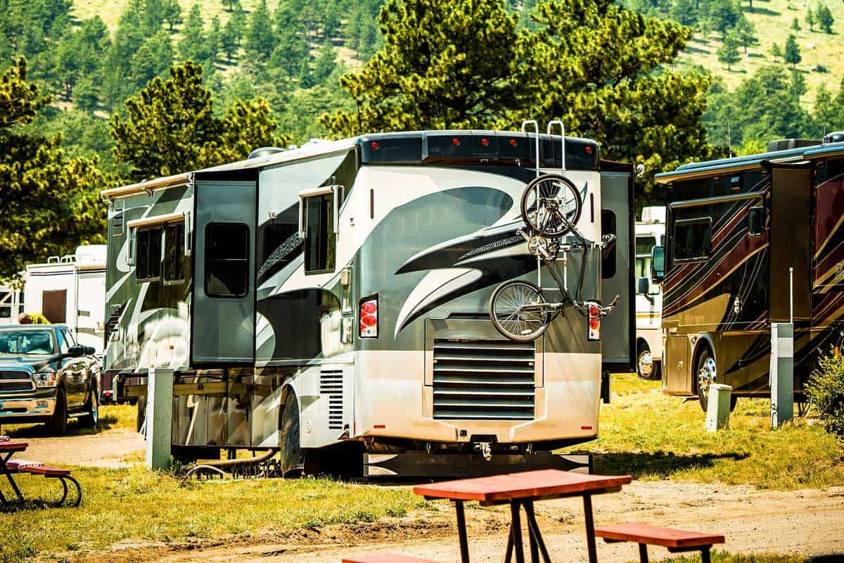 A big class A motorhome in an RV park, What Is the Average Height of an RV (Including 16 examples)