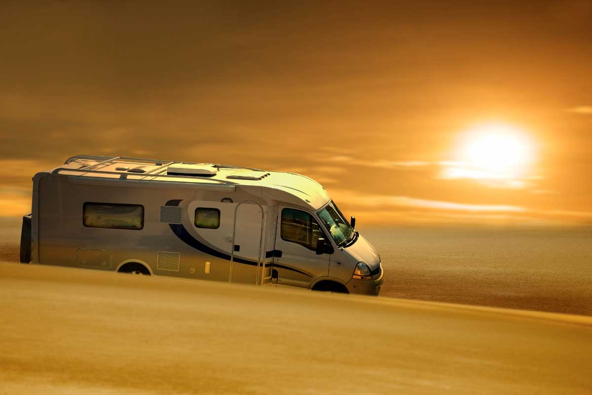Rv in the middle of the road, sun is setting
