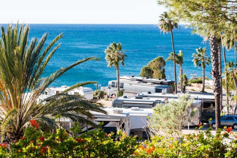 white RVs in the California beach - RV Laws In California You Should Be Aware Of [Inc. Parking Laws]