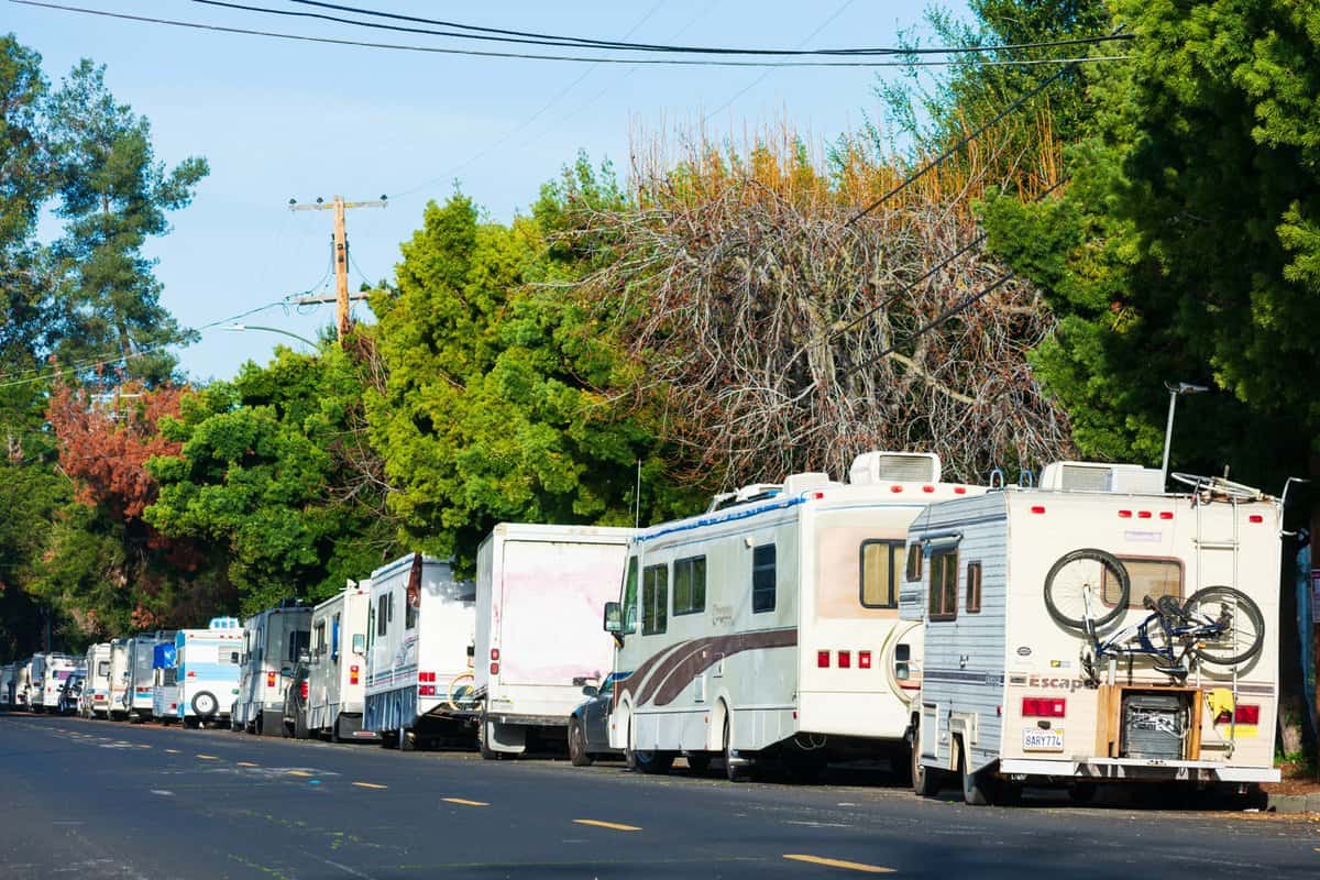 RV, campers and vans long term parked in row on public street in Silicon Valley. Symbol of the economic inequality and housing crisis existing