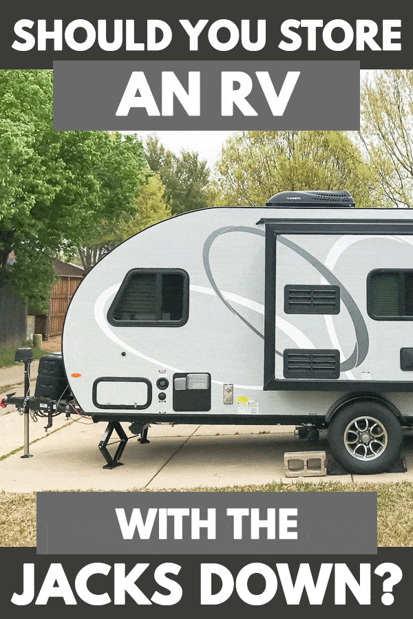 Extreme side view of an RV with jacks down, Should You Store An RV With The Jacks Down?