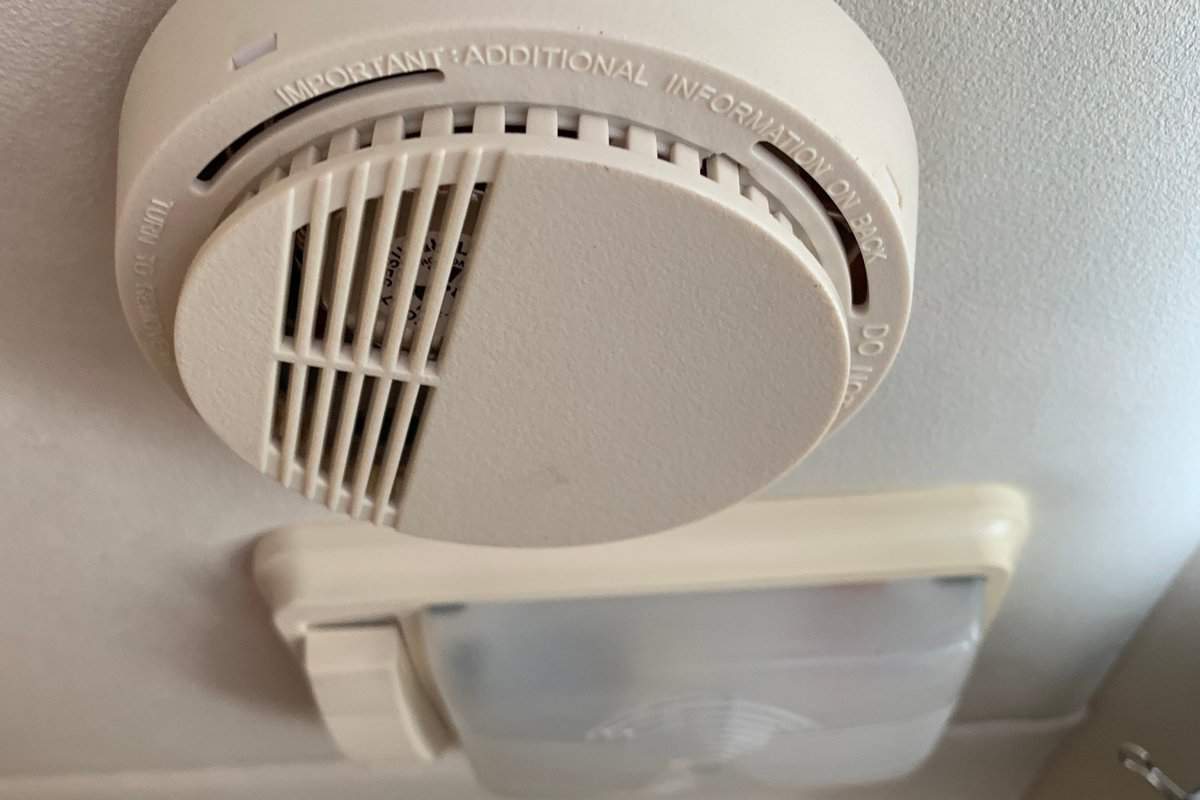 Smoke detector and ceiling light in small camper van