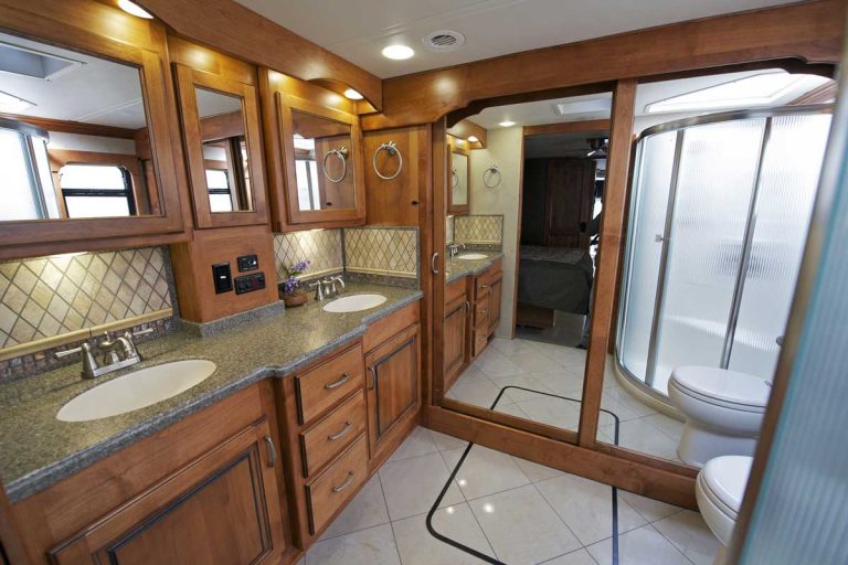 Large RV Bathroom with wooden cabinets, 14 RV's With An Extra Large Bathroom [Illustrated Examples]