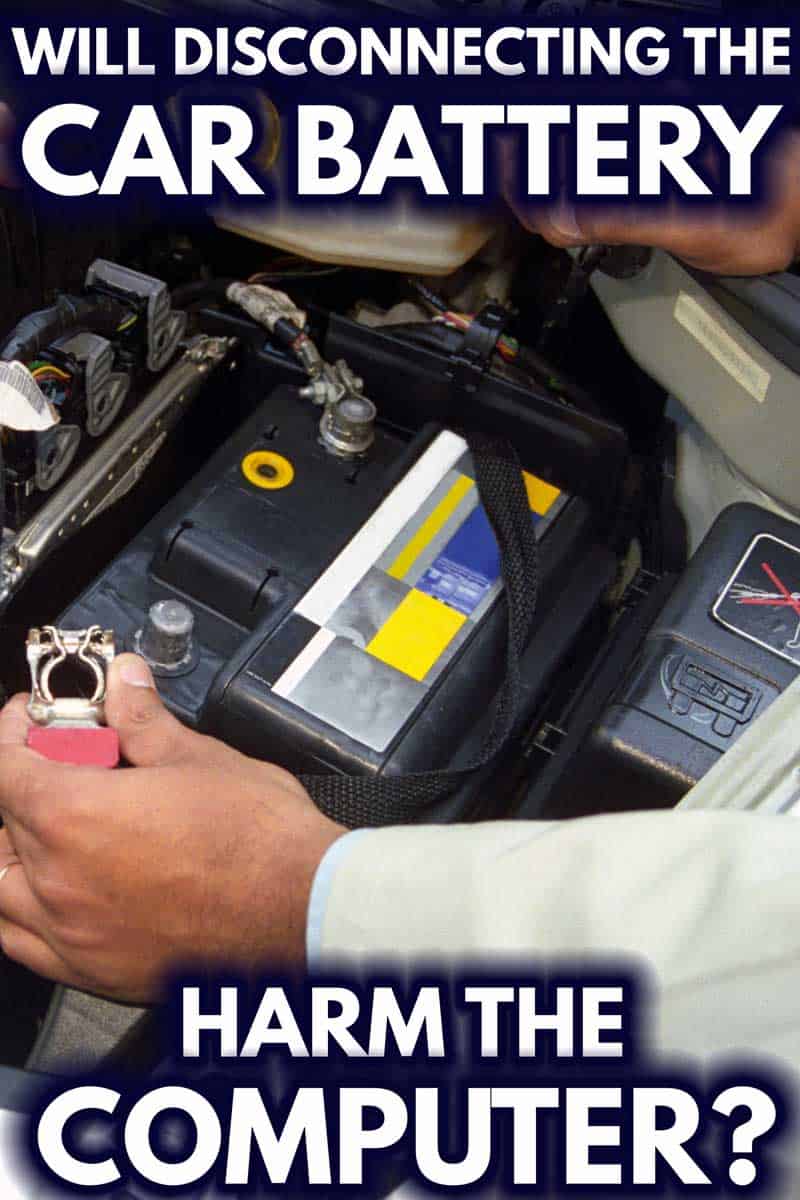 A mechanic disconnecting the car battery terminal