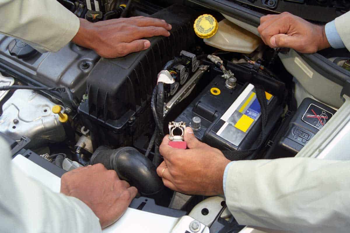 A car mechanic disconnecting the car battery terminal, Will Disconnecting the Car Battery Harm the Computer?