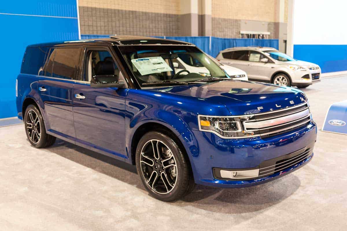 A blue Ford Flex parked on a car dealership, Ford Flex: What Are the Common Problems?