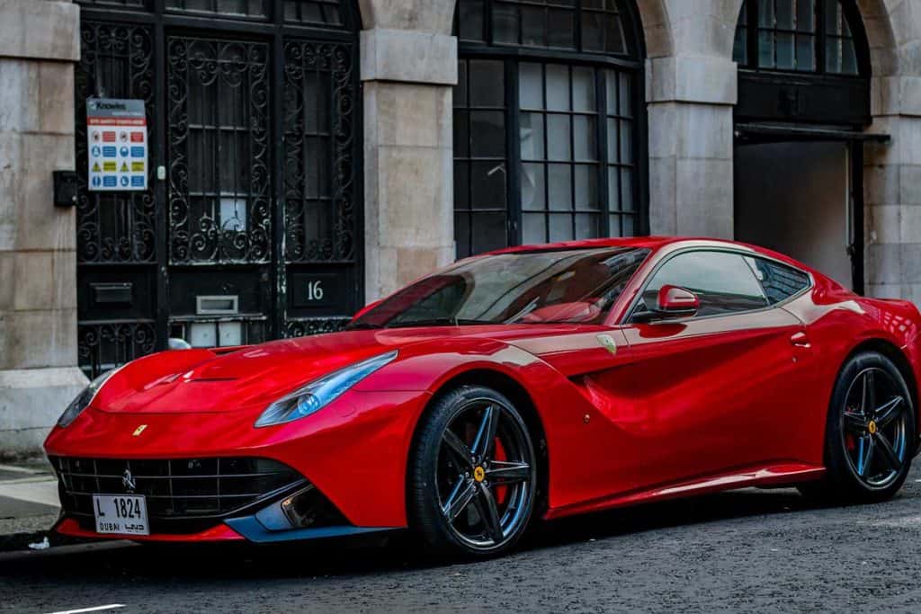 Ferrari parked next to a building