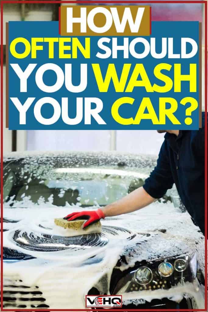 Man washing car hood using sponge, How Often Should You Wash Your Car?