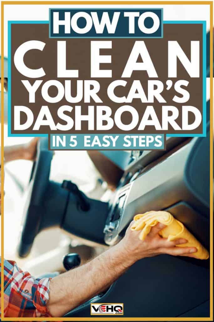 Man cleaning car dashboard using yellow cloth
