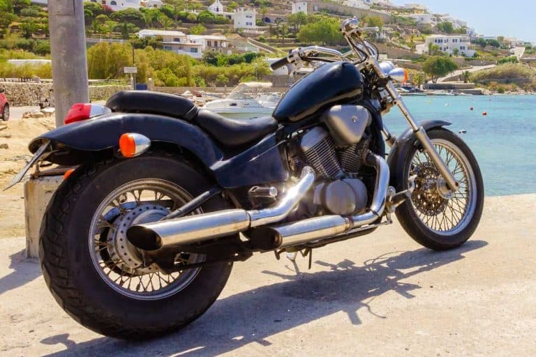 An old vintage motorbike parked by the beach, What Is A Bobber Motorcycle? [5 Things You Should Know]