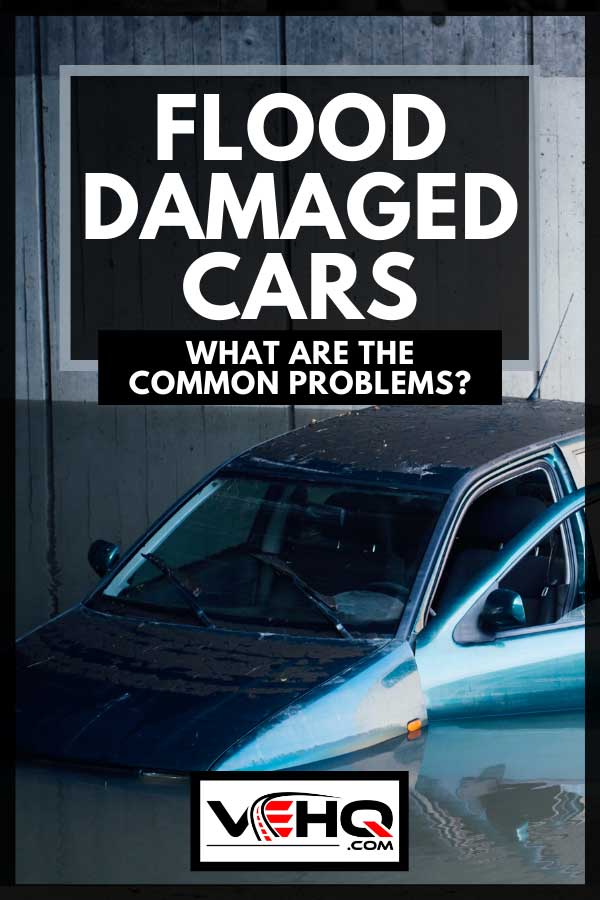 Blue car flooded on a freeway with door left open, Flood Damaged Cars - What Are The Common Problems?