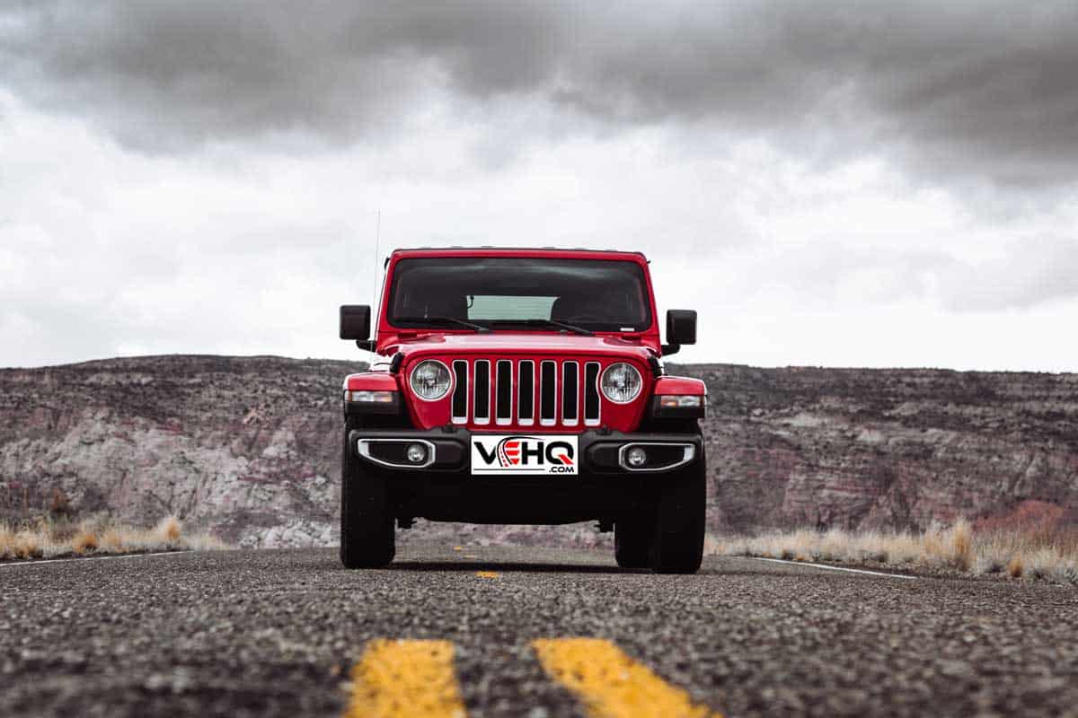 Photo of a Jeep Wrangler Sahara 2019 edition parked in the centre of the road in Page, Arizona on a cloudy day.