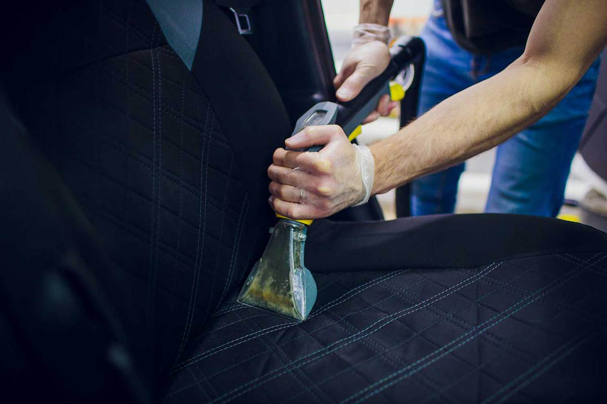 Car interior textile seats chemical cleaning with professional extraction method
