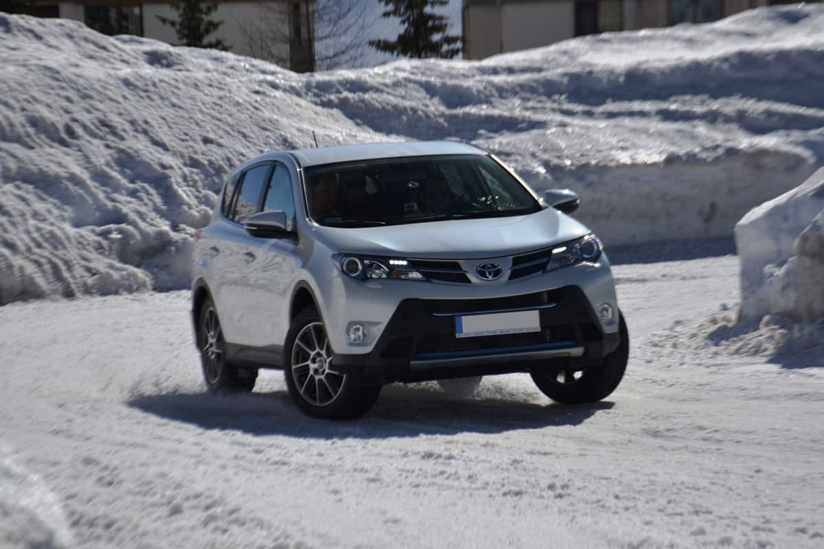 Toyota Rav 4 cruising on an icy terrain, What Are The Trim Levels For Toyota Rav4?