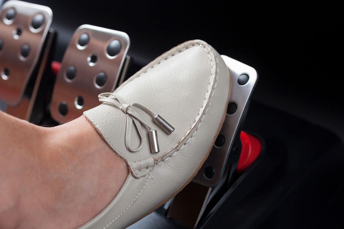 releasing gas pedal of woman feet