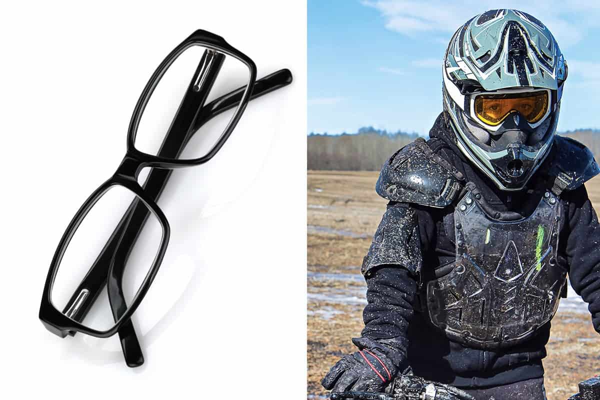 A motorcycle rider wearing helmet and carrying a motorcycle, Can You Wear Motorcycle Goggles Over Glasses?