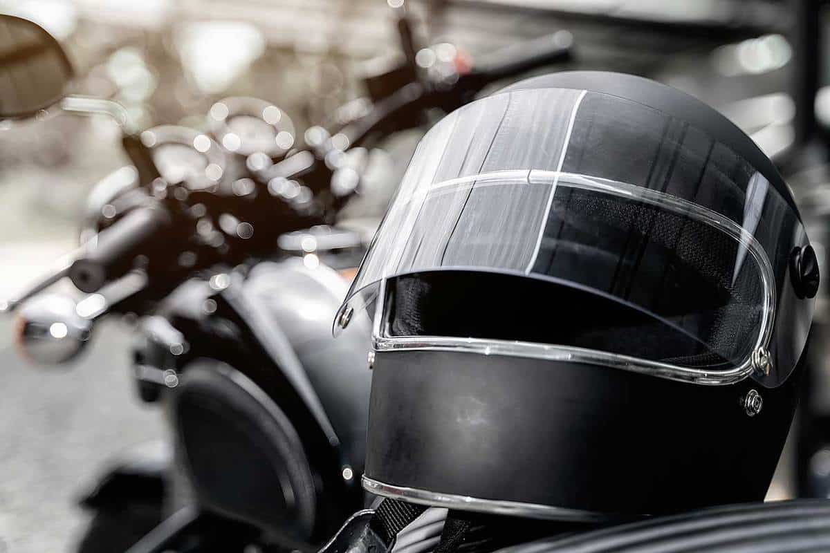 Black helmet on motorcycle seat