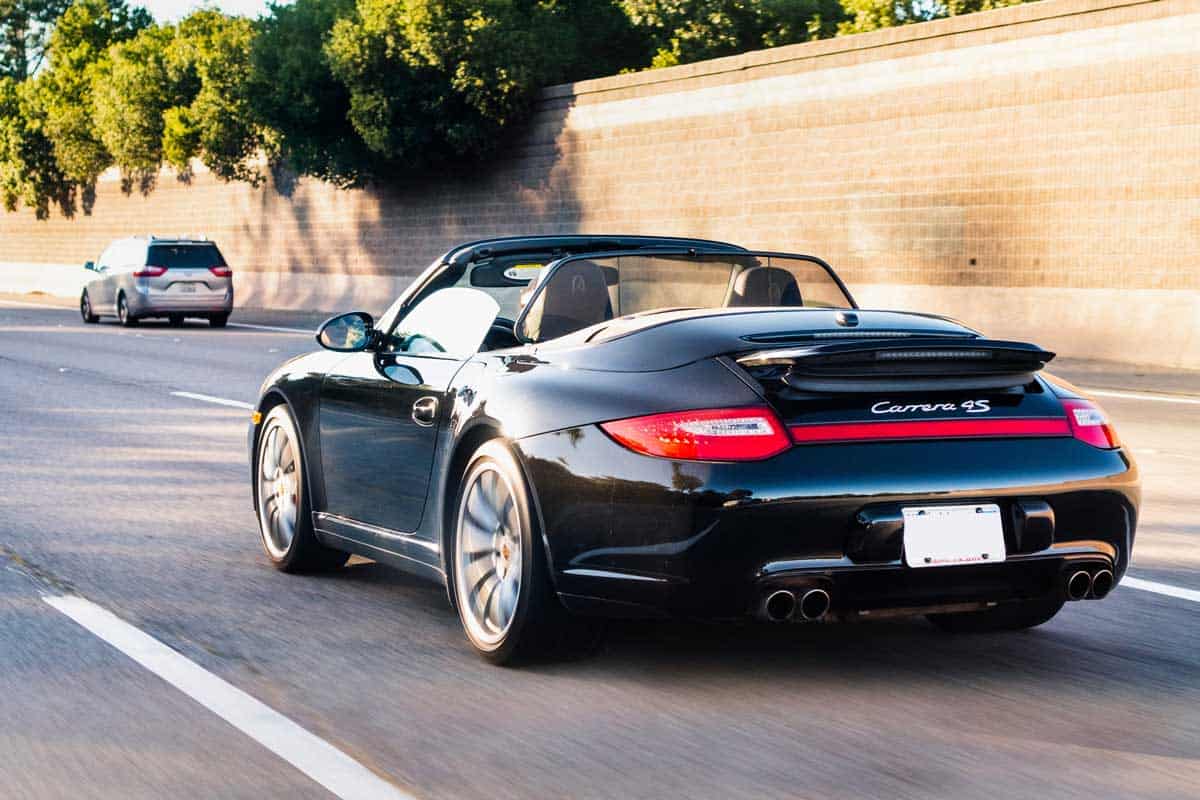 Porsche Carrera 4S vehicle driving on a freeway in San Francisco Bay Area, My Wheel Is Wobbling When Driving – What’s Going On?