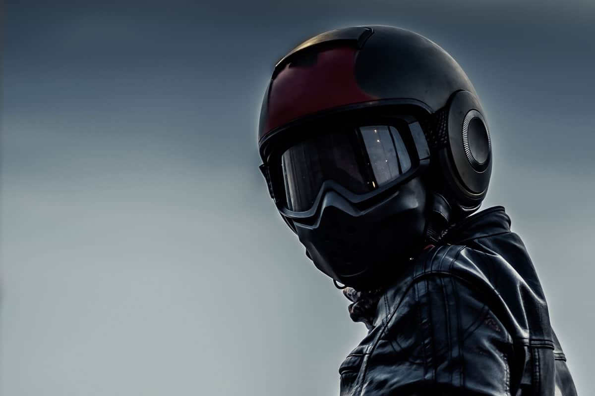 A dark biker helmet with goggles and mask, How Do Bluetooth Helmets Work