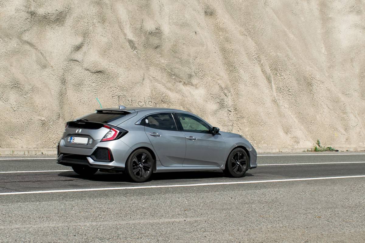 A Honda Type R moving on the road, What's a Good Mileage for a Used Car? [12K Miles Rule Explained]