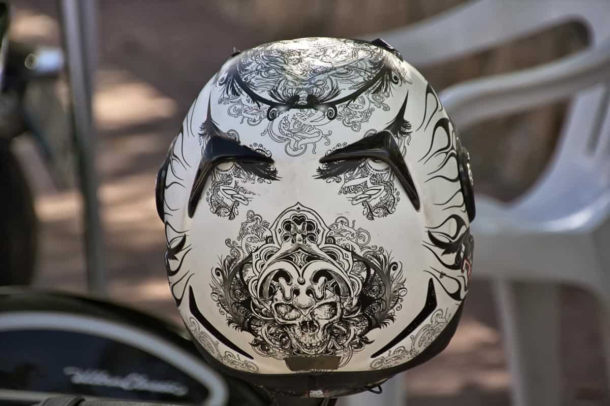 A motorcycle helmet with decorative drawing on the surface, How Can I Decorate My Motorcycle Helmet?