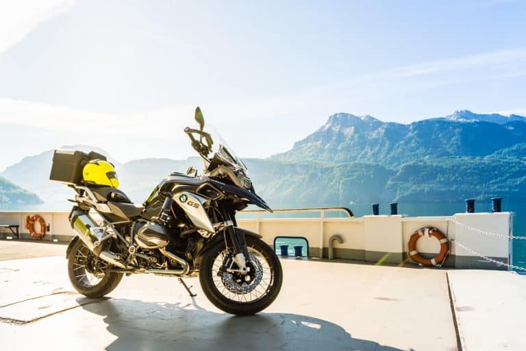 A BMW GS 1250 parked on the side of the road with a panoramic view of the mountains, How Much Can You Tow With A Motorcycle?