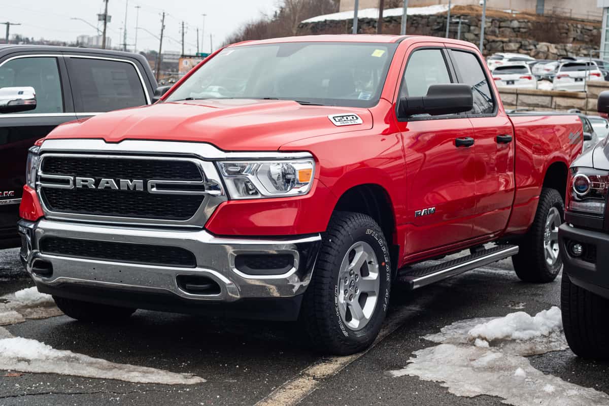 A Red dodge Ram Tradesman Crew Cab parked on a snowy parking lot, 16 4-Door (Crew Cab) Trucks with Long Beds