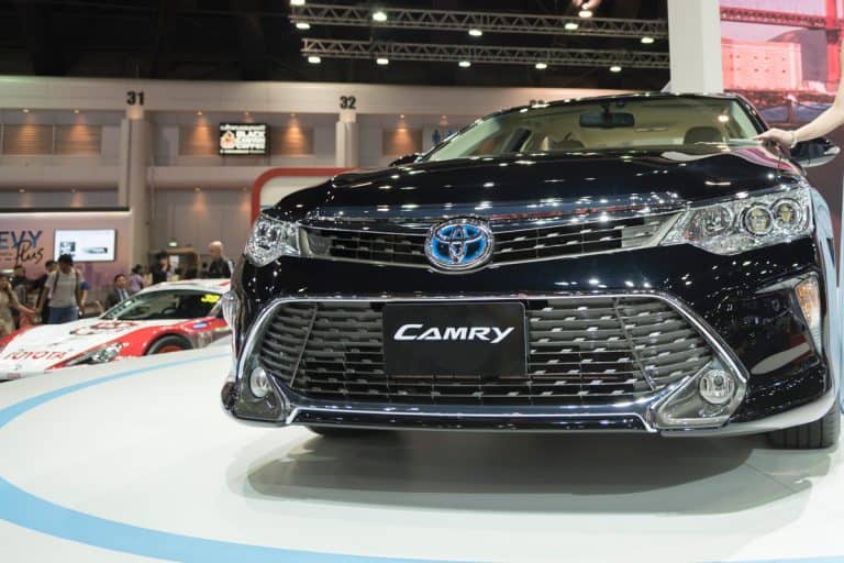 A Toyota Camry hybrid at a car show, Can A Toyota Camry Take Premium Gasoline? 