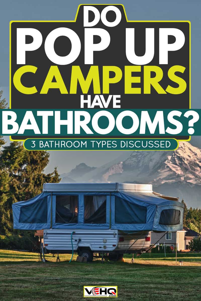 A pop-up camper already set up for camping at a camp site with a panoramic view of Mount Rainier, Do Pop Up Campers Have Bathrooms? [3 Bathroom Types Discussed]