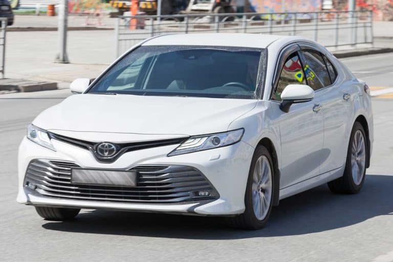The new Toyota brand car model Camry white, Can You Flat Tow A Toyota Camry? [And how to safely do that]