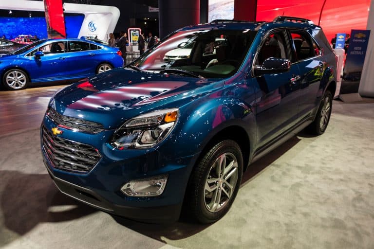 A blue Chevy Equinox at a car show, Can I Flat Tow a Chevy Equinox? [Here's How To]