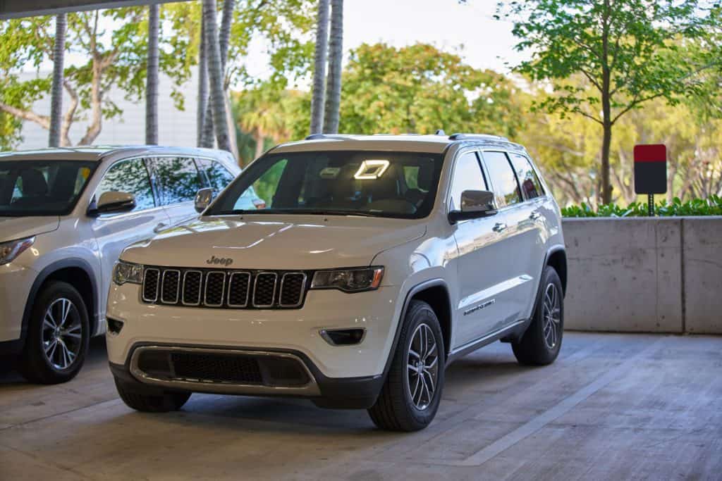 A white Jeep Cherokee on a nice parking, Can You Flat Tow A Jeep Cherokee [By trim levels]