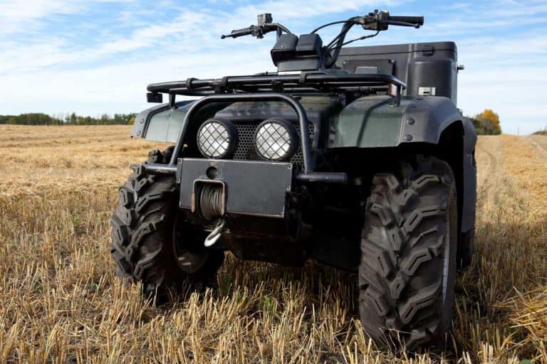 An all terrain vehicle in a farmers harvested field, How To Keep ATV Tires From Going Flat?