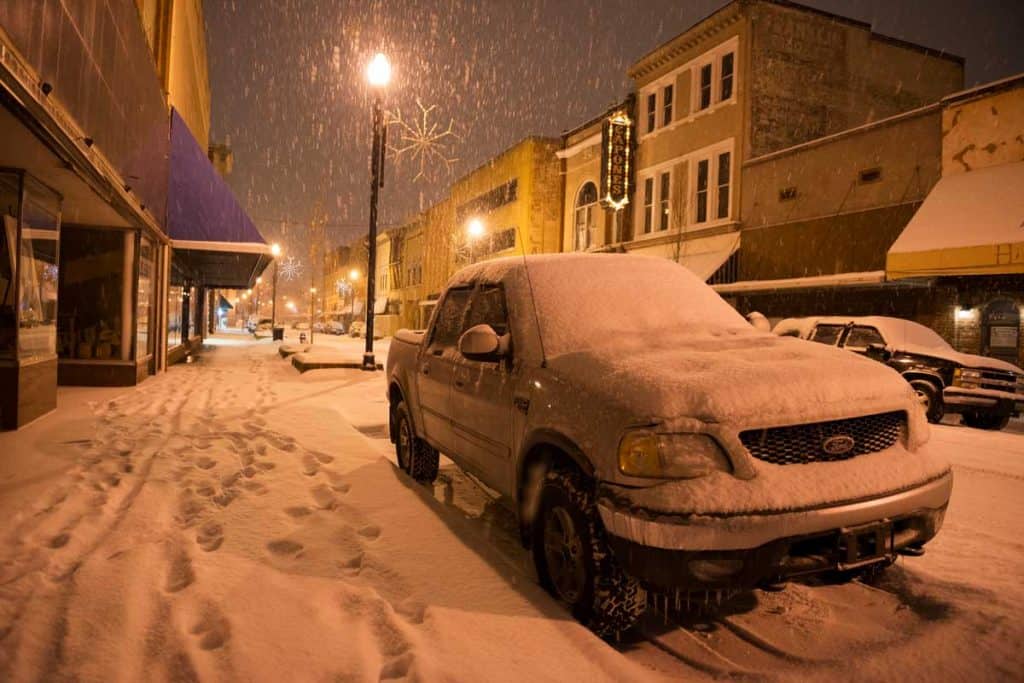 Heavy snow falls on E Main Street at 10:30 p.m. in downtown Johnson City, Tennessee. A Ford F-150 is parked in the foreground.