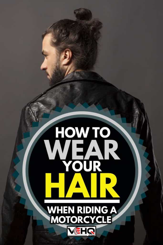 back view of man with beard and bun in black leather jacket, How To Wear Your Hair When Riding A Motorcycle?