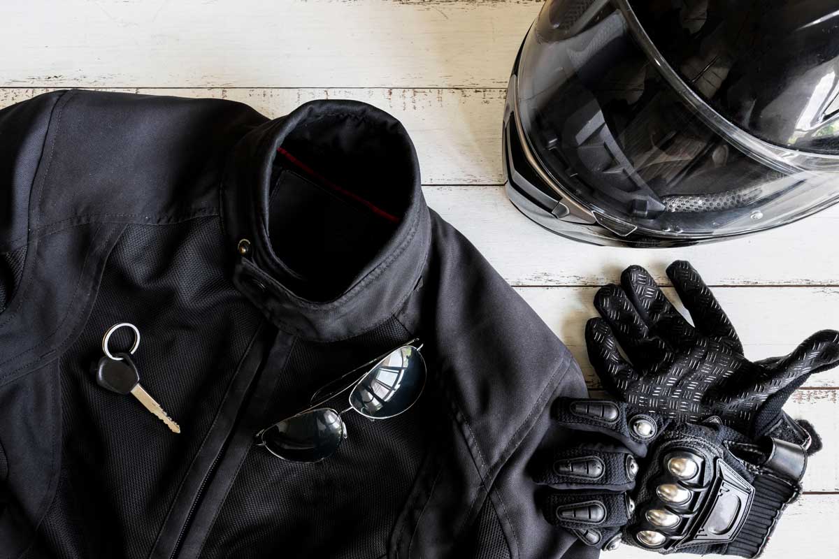 Outfit of Biker and accessories with copy space, Ready to ride, Motorcycle Safety Gear Checklist [7 Must Haves!]
