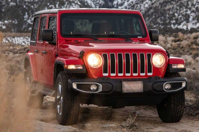 Photo of a Jeep Wrangler Sahara parked on a dirt road, Does Jeep Wrangler Have Bluetooth? [Various Models Reviewed]