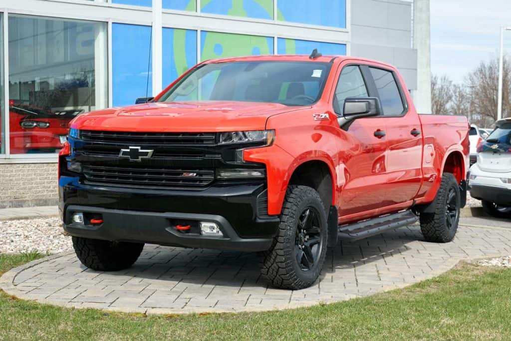Red Chevy Silverado car. Chevrolet colloquially referred to as Chevy and formally the Chevrolet Division of General Motors American car manufaturing Company, Chevy Silverado Dimensions [Inc. How Long a Chevy Silverado Bed Is]