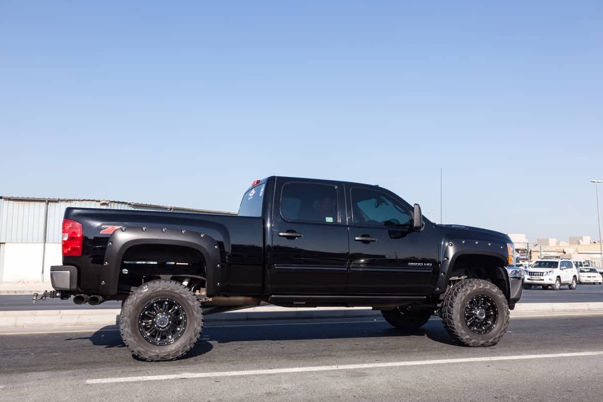 Huge Chevy Silverado uplifted with huge tires cruising down the road, Chevrolet Silverado Gauges Not Working - What Could Be Wrong?