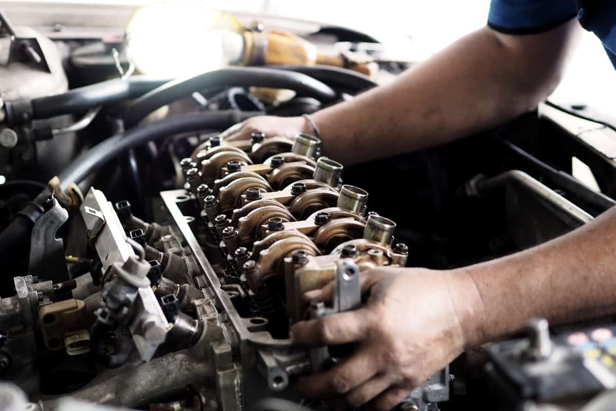 A mechanic repairing an engine, Do Diesel Engines Have Spark Plugs?