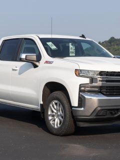 Chevrolet Silverado 1500 display. Chevy offers the Silverado 1500 in WT, Custom, Custom Trail Boss, LT, RST, LT Trail Boss, LTZ, and High Country models. - How Much Weight Can A Truck Carry [By Truck Type]