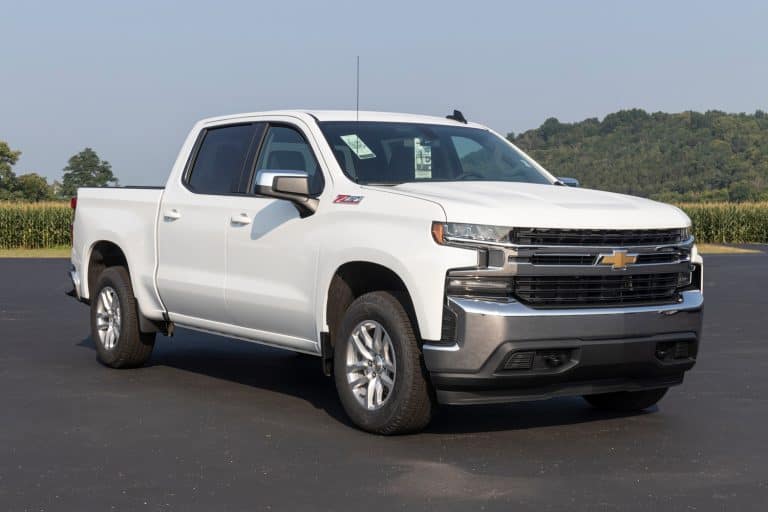 Chevrolet Silverado 1500 display. Chevy offers the Silverado 1500 in WT, Custom, Custom Trail Boss, LT, RST, LT Trail Boss, LTZ, and High Country models. - How Much Weight Can A Truck Carry [By Truck Type]
