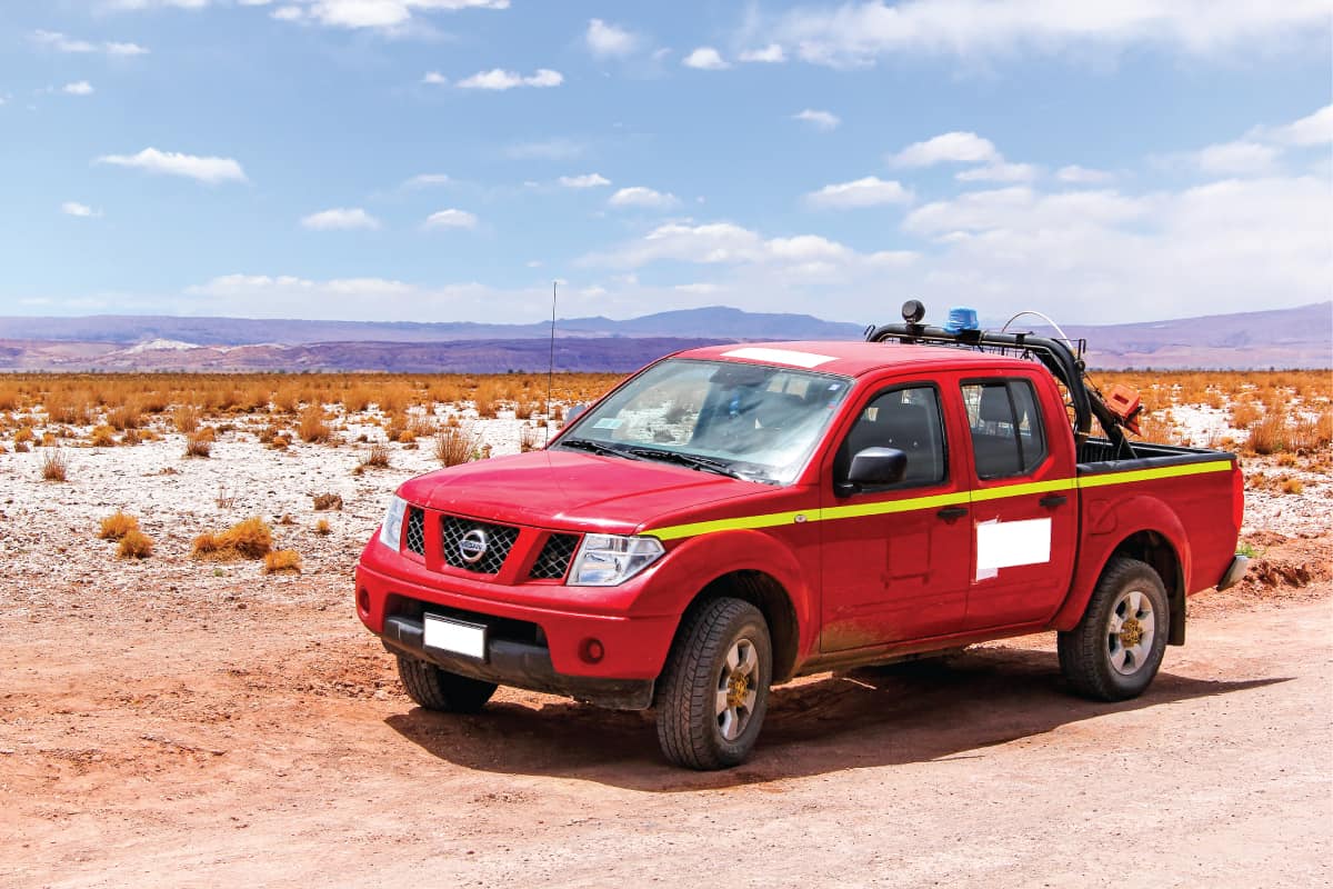 red nissan frontier traversing a dessert area How Long Will a Nissan Frontier Last