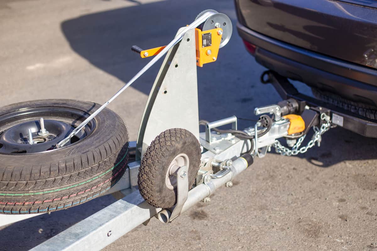 tow hitch for towing a trailer by a passenger car, trailer drawbar with a spare wheel