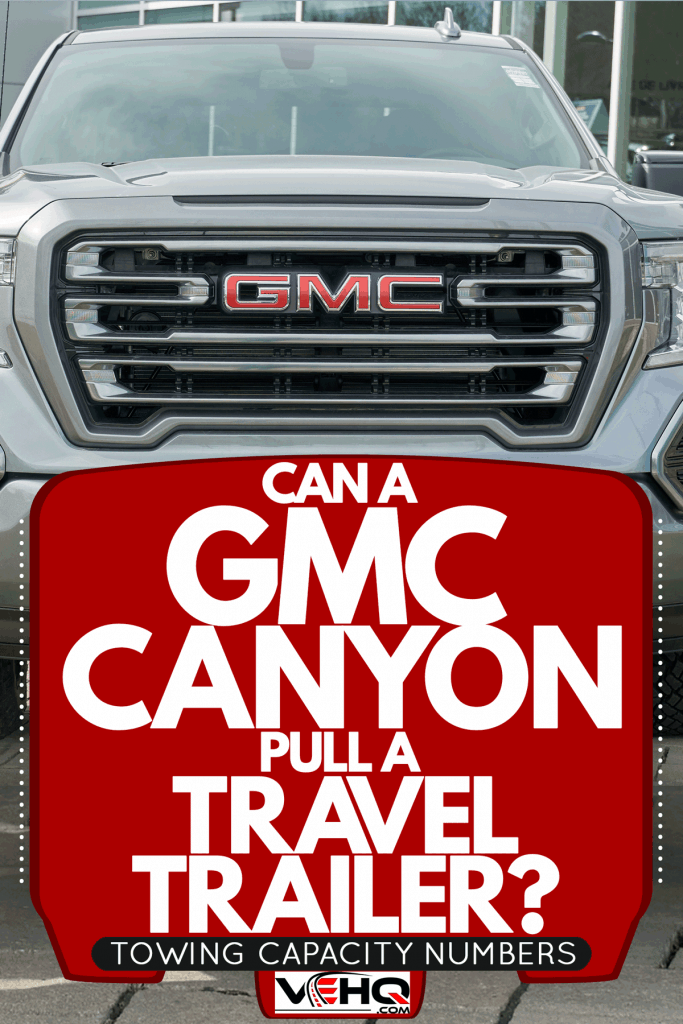 A huge GMC Canyon truck parked outside a car dealership, Can A GMC Canyon Pull A Travel Trailer? [Towing Capacity Numbers]
