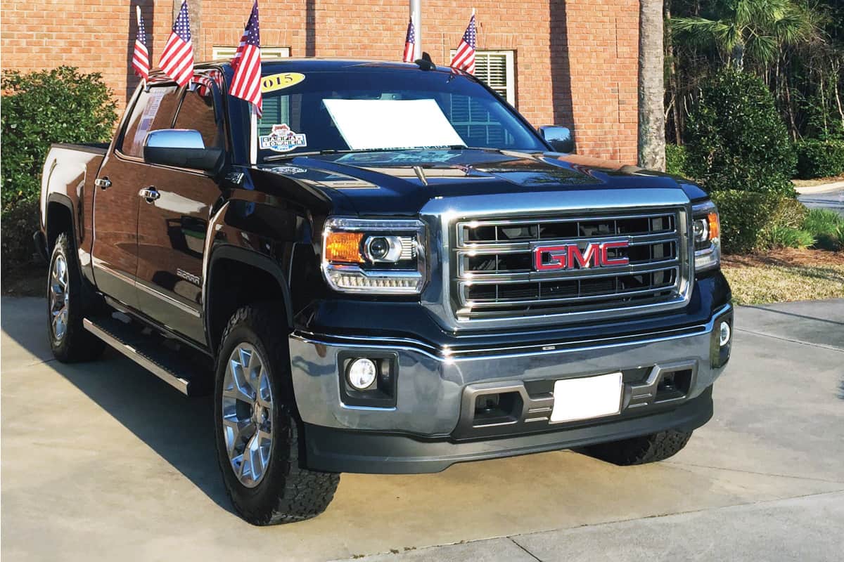 Brand new GMC pickup truck with an American flag, How Many Miles Can A GMC Canyon Last?