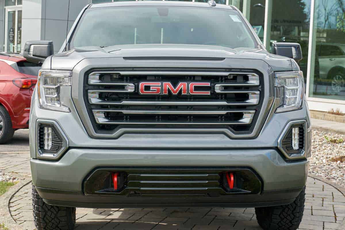 A GMC Canyon AT4 outside a car dealership, GMC Canyon Screen Not Working - What To Do?